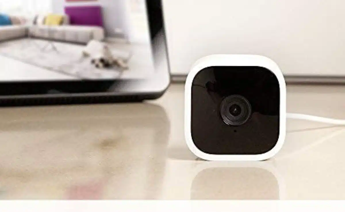 Blink camera on table with Alexa in background showing security footage