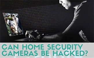 Person hacking into security camera on laptop (Can Home Security Cameras Be Hacked?)