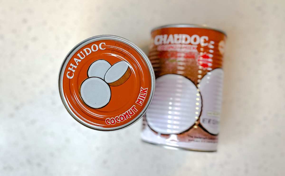 2 cans of Chaudoc coconut milk on counter.