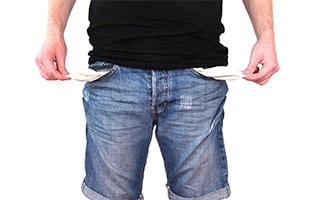 Man standing with empty pockets