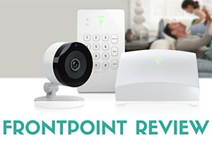 Family on sofa with security camera and eqiupment on table (caption: Frontpoint Review)