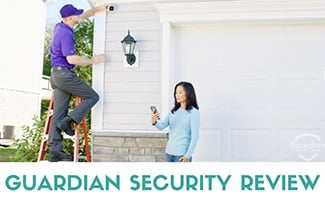 Guardian installer putting up outdoor security camera (caption: Guardian Security Review)