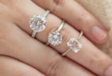 Female hand with multiple diamonds on it.