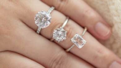 Female hand with multiple diamonds on it.