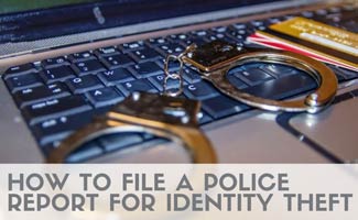 handcuffs, card on a laptop (Caption: How To File A Police Report For Identity Theft)