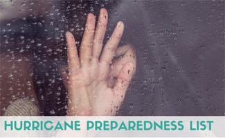 Girl crying and holding her hand up to rainy window (Caption: Hurricane Preparedness List)