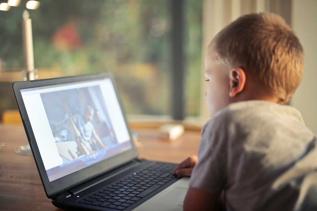 Child looking at laptop