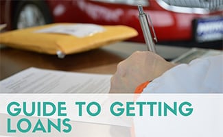 Man filling out car loan application (Caption: Guide to getting loans)