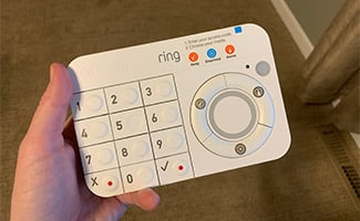 Hand holding a Ring Alarm keypad