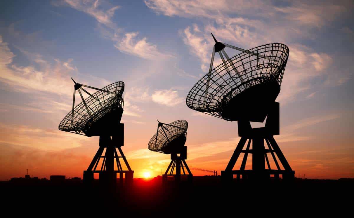 Satellite dishes at sunset.