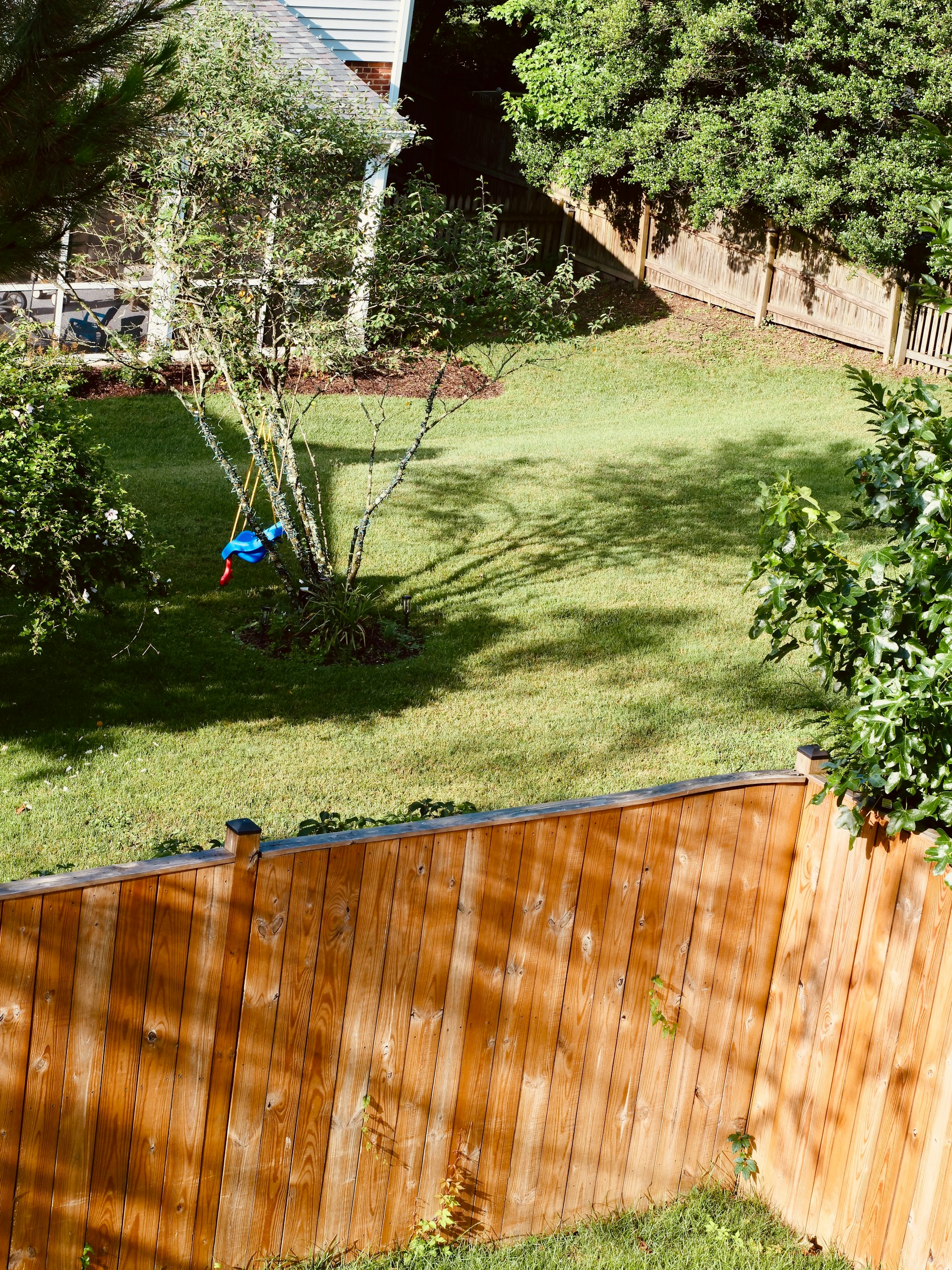 view of a backyard over a fence
