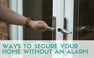 Person locking doors (caption: Ways To Secure Your Home Without An Alarm)