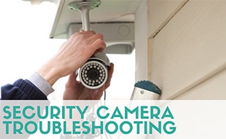 Personal fixing wires on security camera outside (caption: Security Camera Troubleshooting)