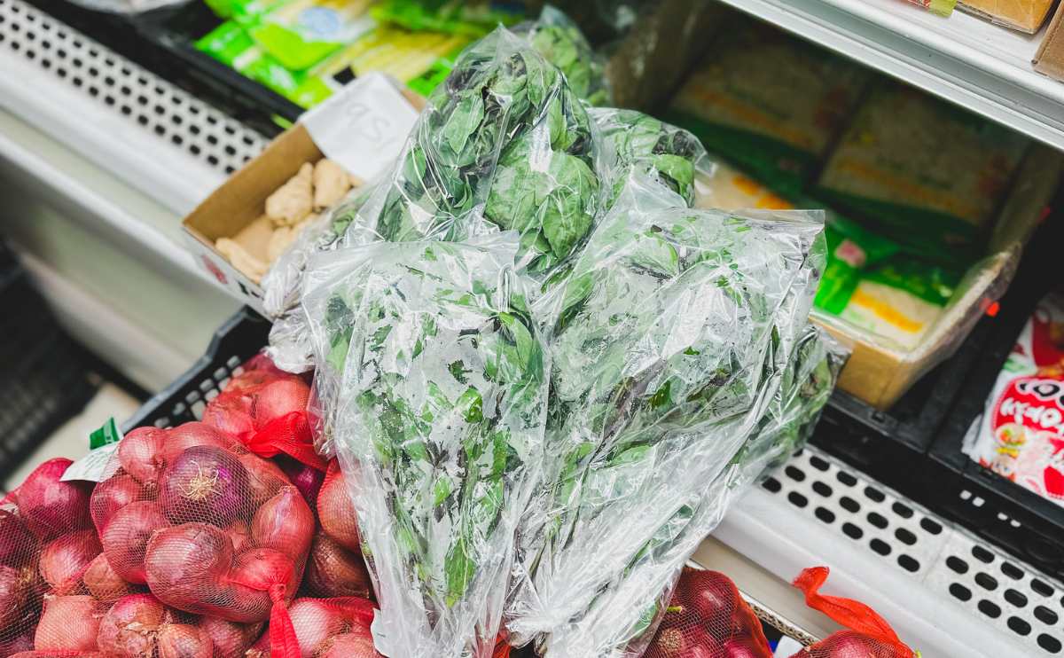 Shopping for sweet basil leaves at an Asian market.