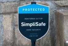 SimpliSafe sign in front of a house up close.