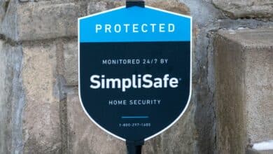 SimpliSafe sign in front of a house up close.