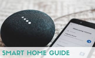 Google Mini on table with iPhone, caption: Smart Home Guide