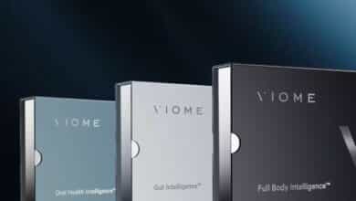 Three viome test boxes on black background