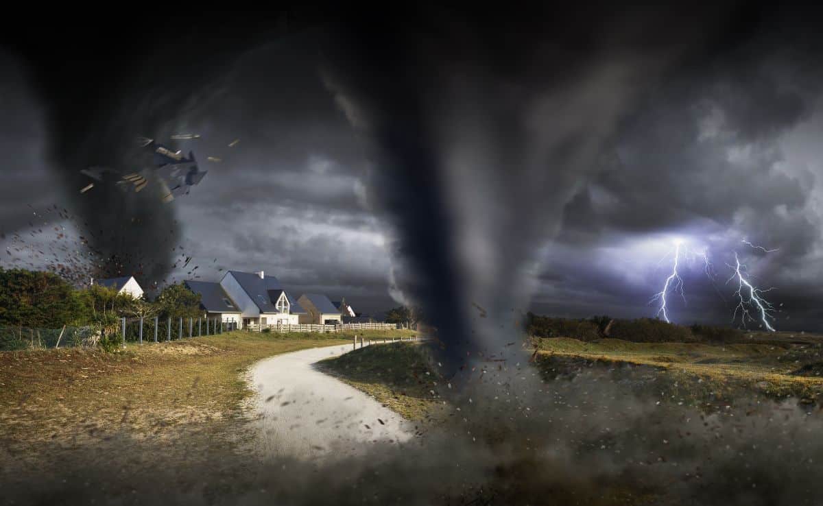 tornado storm with houses in a field