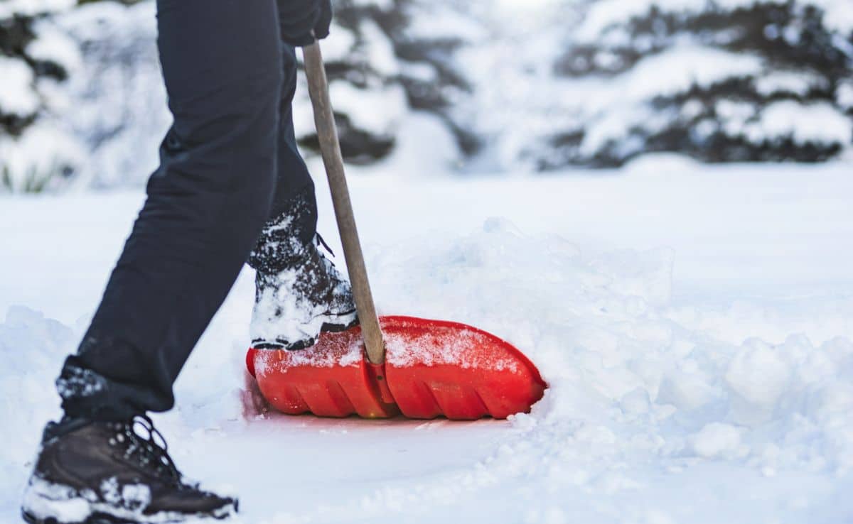 Man shoveling snow in winter