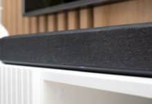 Wireless soundbar on a TV stand up close.