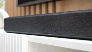 Wireless soundbar on a TV stand up close.